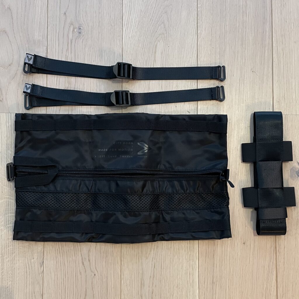 Molle straps (on top), space bag (bottom), and bottle holder (right)